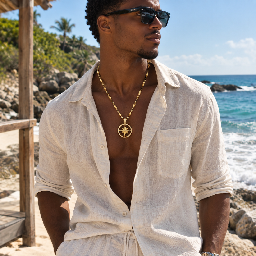 Model wearing a Montreux gold chain by the ocean